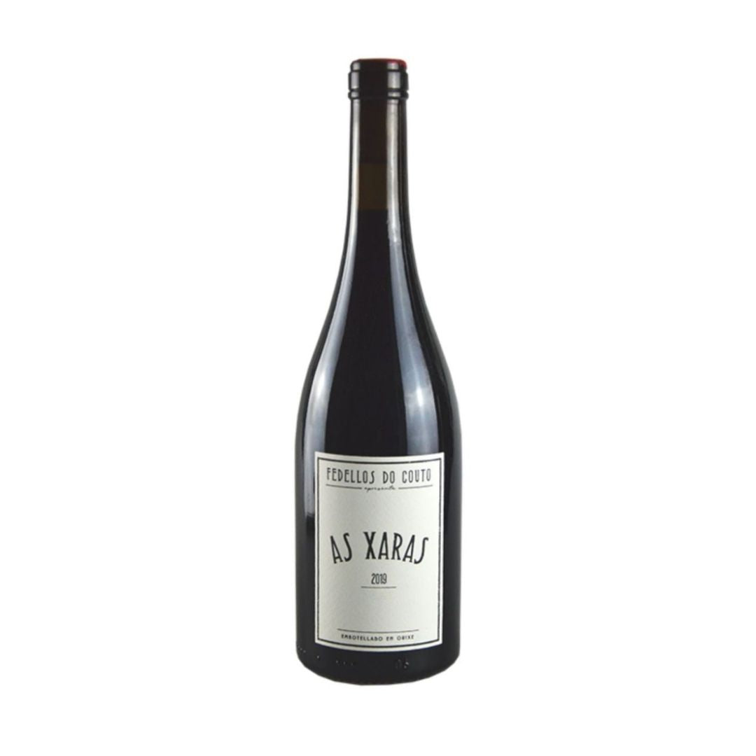 A bottle of As Xaras wine with a label that includes the name 'AS XARAS' 
